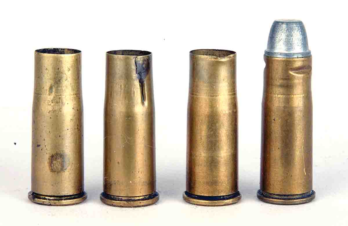 These .38-40s show how things can go wrong (left to right): a case shoulder is not set back far enough during resizing; a case collapsed due to excessive lube; a case mouth damaged by the resizing die mouth; and a case buckled due to excessive crimping – or missing the crimping groove altogether.